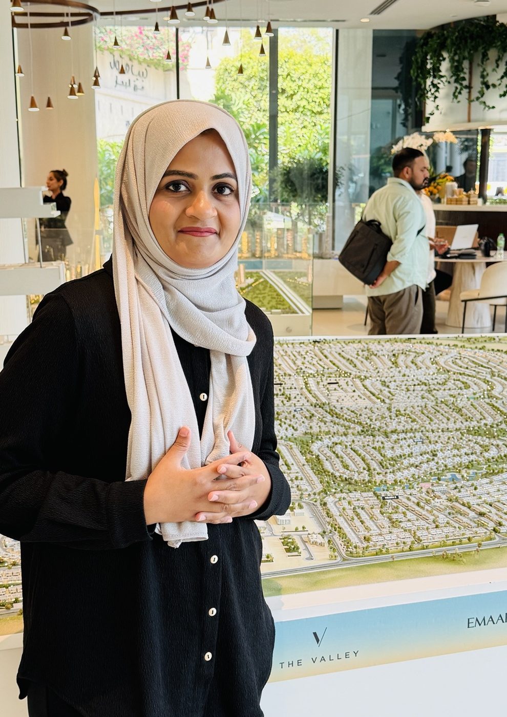 Saima Yasmin Khan beside an Emaar master-plan model